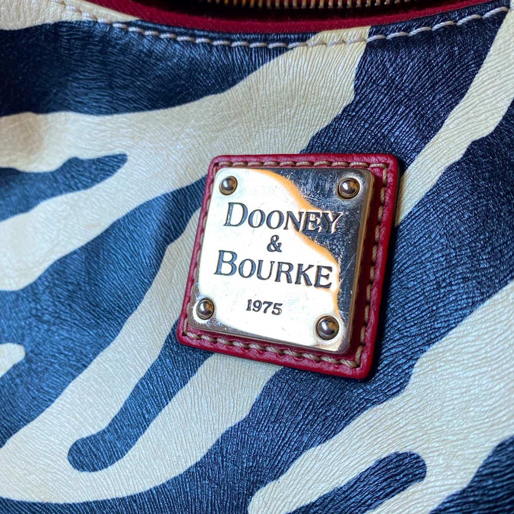 Zebra print Dooney and Bourke shoulder bag. Red leather strap. Authenticated.